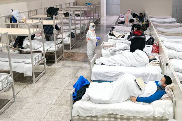 (200206) -- BEIJING, Feb. 6, 2020 -- Patients infected with the novel coronavirus are seen at a makeshift hospital converted from an exhibition center in Wuhan, central China s Hubei Province, Feb. 5, 2020. TO GO WITH Virus-hit Wuhan speeds up diagnosis of patients ) CHINA-CORONAVIRUS-PATIENTS-DIAGNOSIS (CN) XiongxQi 