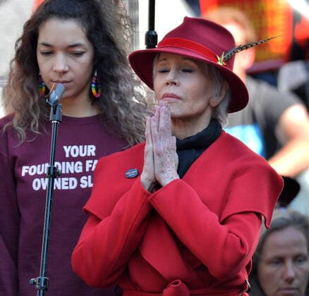 Actress Jane Fonda Jane Fonda (R) gestures in prayer while standing on stage with young Gabrielino women during the Fonda-Fire Drill Friday s fossil fuel protest outside City Hall in downtown Los Angeles, California on February 7, 2020. - The Gabrielino are an indigenous group of people in Southern California during a Fired Frill Friday event outside City Hall in Los Angeles on Friday, February 7, 2020. Fonda, 81, was arrested five times in the last year for her protests in Washington D.C., and she said it was the younger generation that has inspired the elders to join them in the fight against change climate. Activists spoke about the health problems people experience when living near oil and gas extraction, particularly in low-income neighborhoods. Studies have linked people to developing cancer and other health issues. It is not the c  LAP2020020707 JIMxRUYMEN