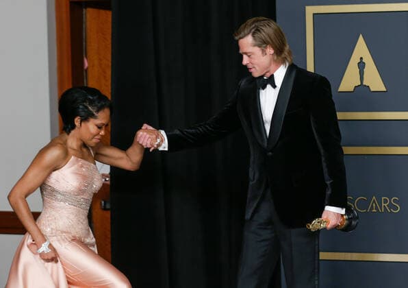 Regina King and Brad Pitt, winner of Actor In A Supporting Role for Once Upon A Time In Hollywood, appears backstage with his Oscar during the 92nd annual Academy Awards at Loews Hollywood Hotel in the Hollywood section of Los Angeles on Sunday, February 9, 2020.  LAP20200209388 JOHNxANGELILLO
