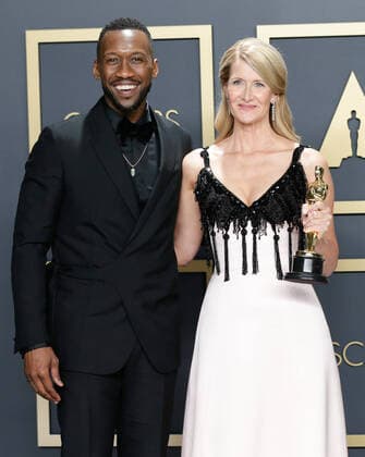 Mahershala Ali (L), with Laura Dern, winner of the Best Actress in a Supporting Role for Marriage Story, appears backstage with her Oscar during the 92nd annual Academy Awards at Loews Hollywood Hotel in the Hollywood section of Los Angeles on Sunday, February 9, 2020.  LAP20200209712 JOHNxANGELILLO