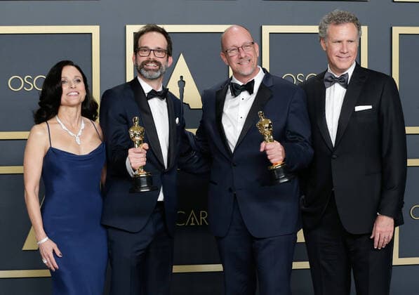 Andrew Buckland (2nd L) and Michael McCusker (2nd R), winners of Best Film Editing for Ford v Ferrari, appear backstage with their Oscar and Julia Louis-Dreyfus (L) and Will Ferrell, during the 92nd annual Academy Awards at Loews Hollywood Hotel in the Hollywood section of Los Angeles on Sunday, February 9, 2020.  LAP202002092056 JOHNxANGELILLO