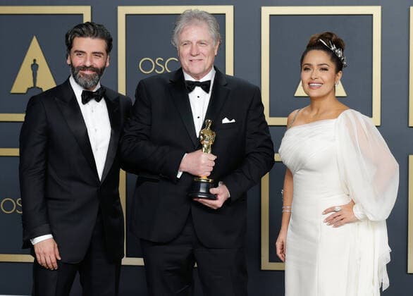 Donald Sylvester (C), winner of Best Sound Editing for Ford v Ferrar, appears backstage with his Oscar and Oscar Isaac (L) and Salma Hayek (R) during the 92nd annual Academy Awards at Loews Hollywood Hotel in the Hollywood section of Los Angeles on Sunday, February 9, 2020.  LAP202002092063 JOHNxANGELILLO