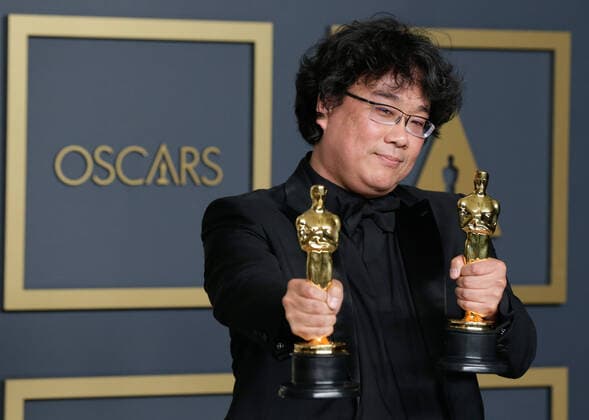 Bong Joon-ho, winner of Best Original Screenplay, Best Director and Best Picture for Parasite, appears backstage with his Oscar during the 92nd annual Academy Awards at Loews Hollywood Hotel in the Hollywood section of Los Angeles on Sunday, February 9, 2020.  LAP202002092092 JOHNxANGELILLO