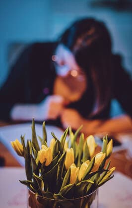 Kaprun THEME IMAGE a fresh bouquet of cut flowers stands in front of a woman writing something, taken on 25 January 2020 in Kaprun, Austria Flowers in front of a woman doing handlettering in Kaprun, Austria on 2020 01 25  EP_fei