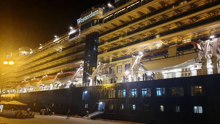 New coronavirus Photo taken Feb. 13, 2020, at the port of Sihanoukville in southern Cambodia shows the Westerdam cruise ship that had been turned away from at least five ports in Asia over fears a person onboard may be suffering a coronavirus infection. Some passengers from the ship began disembarking the following day after the Cambodian government allowed the ship to enter the port on humanitarian grounds. 