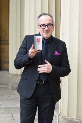 . 14 02 2020. London, United Kingdom. Declan Patrick MacManus, better known by his stage name Elvis Costello, with his OBE for Services to Music after an Investiture at Buckingham Palace in London.  xPoolx xi-Imagesx IIM-20779-0005