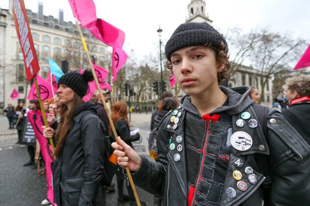 February 15, 2020, London, England, United Kingdom: Extinction Rebellion protesters on the Strand, London as part of a protest against London Fashion Week on Saturday, Feb. 15, 2020. (Photo )..Given the ecological consequences of fast fashion and the impact London Fashion Week has on consumption, the organisation says a boycott is the only way forward to help save our planet..In order to get their message across, the activists will be taking part in several protests during the five-day event in London. London United Kingdom - ZUMAx02_ 20200215_zaf_x02_005 Copyright: xVudixXhymshitix