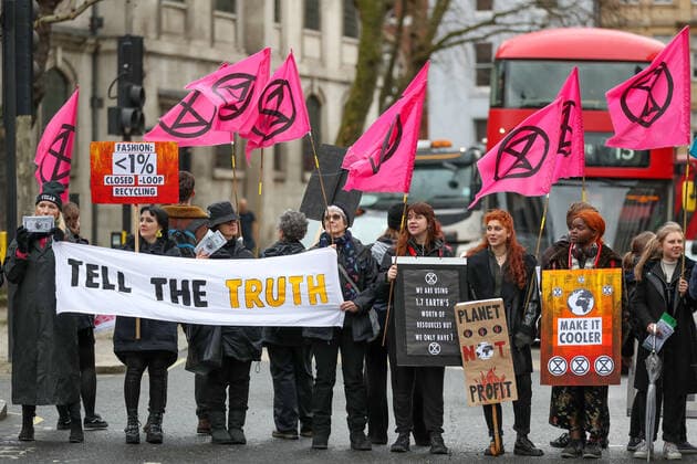 February 15, 2020, London, England, United Kingdom: Extinction Rebellion protesters on the Strand, London as part of a protest against London Fashion Week on Saturday, Feb. 15, 2020. (Photo )..Given the ecological consequences of fast fashion and the impact London Fashion Week has on consumption, the organisation says a boycott is the only way forward to help save our planet..In order to get their message across, the activists will be taking part in several protests during the five-day event in London. London United Kingdom - ZUMAx02_ 20200215_zaf_x02_007 Copyright: xVudixXhymshitix