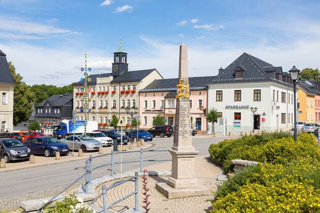 Market place with town hall and post milestone column, Zwönitz, Erzgebirge, Saxony, Germany