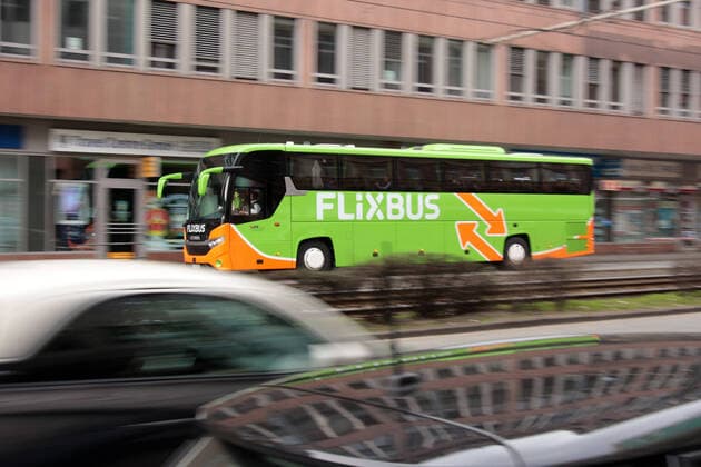 Long-distance bus of the company Flixbus runs in the city centre of Frankfurt, Hesse, Germany