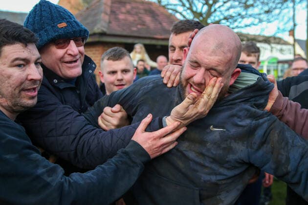 . 25 02 2020. Sedgefield, United Kingdom. The traditional Shrove Tuesday Ball Game in Sedgefield. Where a small, leather ball is chased around the village for hours. Pictured is the winner.  xTomxBanksx xi-Imagesx IIM-20824-0059