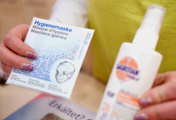 Tuebingen 26 02 2020 Schmuckbild Sale of a hygiene mask and disinfection spray against coronavirus in a pharmacy, protective masks are almost sold out