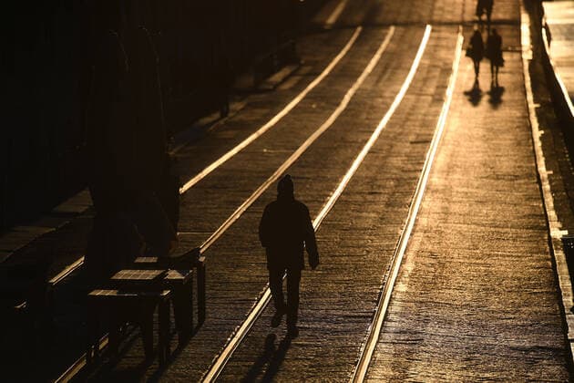 (200227) -- MILAN, Feb. 27, 2020 (Xinhua) -- A man walks past empty tables and seats in Milan, Italy, Feb. 26, 2020. A total of 400 people have tested positive for the novel coronavirus in Italy till Wednesday evening. The government has placed 11 towns, 10 in Lombardy and one in Veneto, under lockdown in an effort to contain the epidemic. (Photo by Daniele Mascolo Xinhua) ITALY-MILAN-COVID-19 