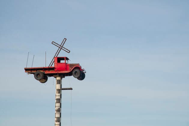 Vintage truck with a cross in the back suspended on a pole in New Mexico, United States of America, North America Copyright: ShannaxBaker 1315-146