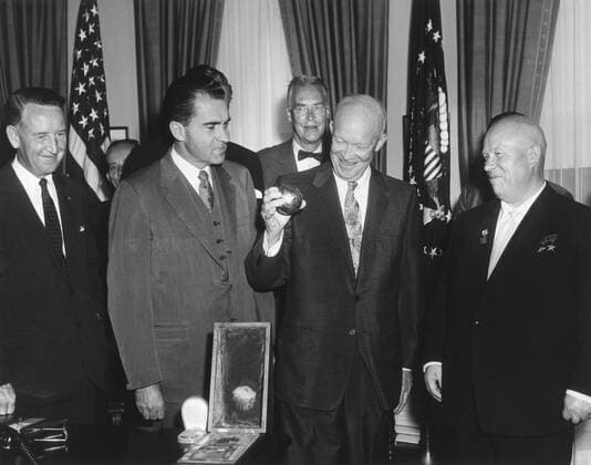 President Eisenhower holding a gift from Soviet Premier Nikita Khrushchev. It was a replica of metal ball, 7.5 cm in diameter, launched to the lunar surface in Luna 2. Shaped like a soccer ball, it bore the Soviet hammer and sickle seal. Sept 15, 1959. L- For usage credit please use; PUBLICATIONXNOTxINxCANxCHNxFRAxITAxJPNxNORxPOLxRUSxESPxUKxUSA Copyright: xCourtesyxEverettxCollectionx HISL038 EC956