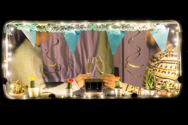 Crop view of couple celebrating New Year s Eve in camper model released Symbolfoto property released  JPTF00456