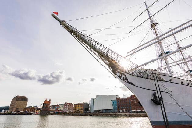 Germany, Mecklenburg-Western Pomerania, Stralsund, Bow of Gorch Fock ship moored in harbor of coastal town  WDF05738