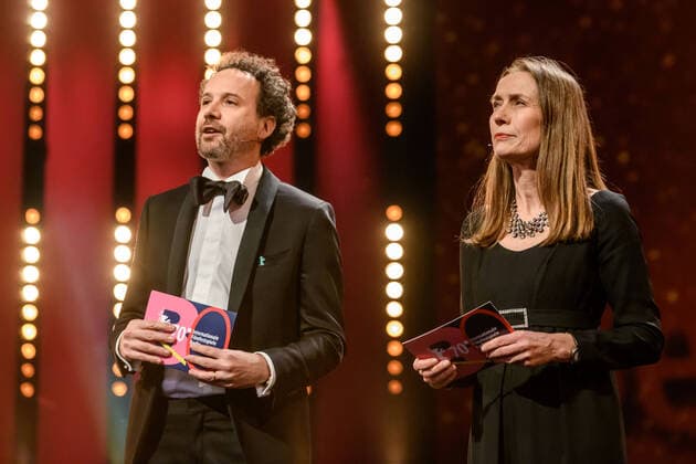 Artistic Director of the Berlinale Carlo Chatrian and Managing Director of the Berlinale Mariette Rissenbeek during the award of the Golden Honorary Bear to Helen Mirren at the 70 Berlin International Film Festival snapshot photography xF Boillot