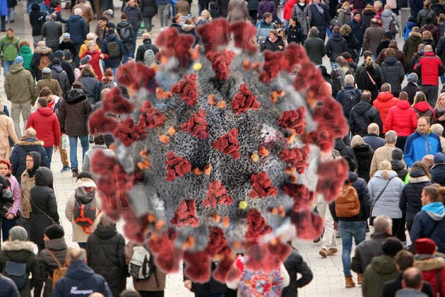 PHOTOMONTAY Symbol image of the spread of the coronavirus in Germany Virus with crowd of people in the pedestrian zone Kaufingerstraße in the city centre of Munich, Bavaria, Germany