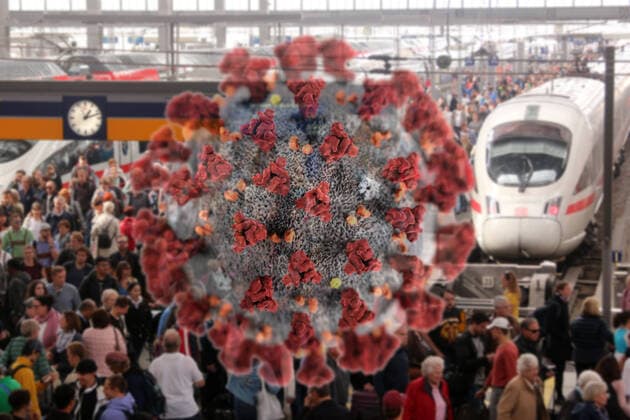 PHOTOMONTAY Symbol image of the spread of the coronavirus in Germany Virus with crowd of people on a crowded platform at Munich Central Station, Bavaria, Germany