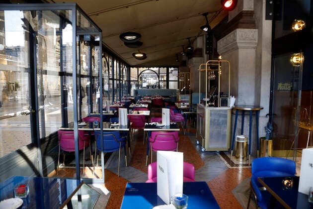 (200229) -- MILAN, Feb. 29, 2020 (Xinhua) -- Photo taken on Feb. 28, 2020 shows the empty tables of a restaurant in Milan, Italy. The total number of confirmed COVID-19 cases in Italy have increased to 888, including 21 fatalities and 46 recoveries, according to the Ministry of Health on Friday. (Photo by Alberto Lingria Xinhua) ITALY-MILAN-COVID-19 