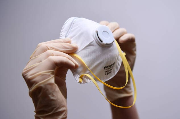 Tuebingen 29 02 2020 Symbol picture hands with disposable gloves and protective mask, protective masks are almost sold out