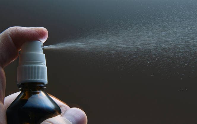 Tuebingen 29 02 2020 Symbol picture One hand with disinfection spray, atomizer