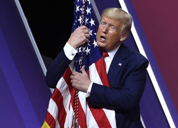 Donald Trump, 75. Geburtstag am 14. Juni 2020 Bilder des Jahres, News 02 Februar News Themen der Woche KW09 News Bilder des Tages President Donald Trump embraces the American flag as he concludes remarks at the Conservative Political Action Conference (CPAC), Saturday, February 29, 2020, in National Harbor, Maryland. Thousands of conservative activists, elected officials and pundits gathered to hear speakers on the theme America vs. Socialism .  WAP20200229514 MIKExTHEILER