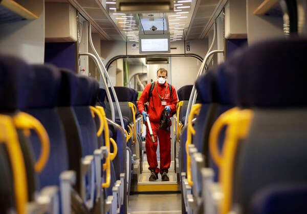 (200301) -- BEIJING, March 1, 2020 -- A staff member sanitizes the facilities on a train at the Garibaldi train station in Milan, Italy, Feb. 28, 2020. A total of 1,049 people tested positive for the novel coronavirus in Italy, Civil Protection Department chief and Extraordinary Commissioner for the coronavirus emergency Angelo Borrelli said on Saturday. (Photo by Xinhua) XINHUA PHOTOS OF THE DAY AlbertoxLingria 