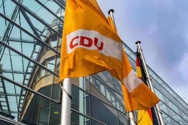 CDU flags in front of the Konrad Adenauer Haus, CDU logo, party headquarters of the CDU in Berlin, federal office of the CDU
