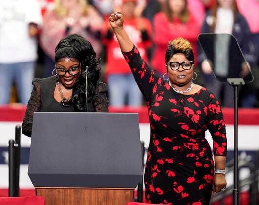 March 2, 2020, Charlotte, North Carolina, USA: LYNNETTE HARDAWAY, left, and ROCHELLE RICHARDSON, American video bloggers known as DIAMOND and SILK, address the crowd during a Keep America Great rally at the Bojangles Coliseum in Charlotte, North Carolina on Monday March 2, 2020. 14 states and American Samoa will vote or caucus on Tuesday March 3rd. Their ballots will represent over 33 percent of the national primary totals. Charlotte USA - ZUMAj110 20200302_zsp_j110_001 Copyright: xRustyxJonesx