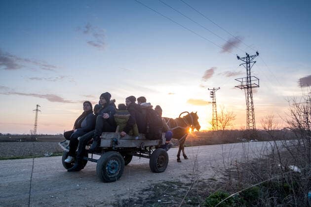 March 3, 2020, Edirne, Turkey: Refugees are transported on carts by gypsis. The main road leading to Pazarkule (buffer zone between Turkey and Greece) being watched by the police, several people offer their services (for a fee) to refugees to bring them closer to the border. After President Erdogan s announcement to open the borders, thousands of refugees gather in the Edirne region in the hope of rallying Greece. March 3, 2020. Pazarkule, Turkey. Turkey - ZUMAp164 20200303_zaa_p164_015 Copyright: xMichaelxBunelx