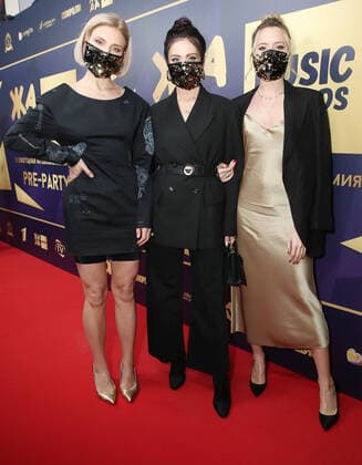 MOSCOW REGION, RUSSIA - MARCH 4, 2020: Members of the Russian pop band Fabrika wearing face masks at the pre-party event for the ZHARA Music Awards 2020 ceremony at Moscow s Crocus City Hall. Vyacheslav Prokofyev TASS  TS0D0C51