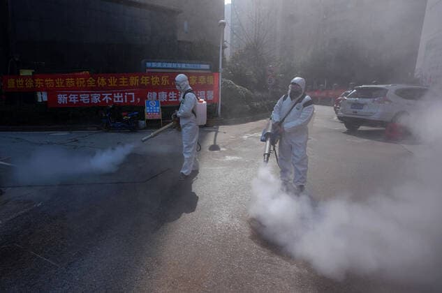 (200305) -- WUHAN, March 5, 2020 -- Staff members from the Wuhan Langqin cleaning service company conduct disinfection at a community in Wuchang District of Wuhan, central China s Hubei Province, March 5, 2020. The Wuhan Langqin cleaning service company has provided cleaning and disinfection service to temporary hospitals, designated isolation hotels, supermarkets, banks and more than 100 communities in Wuhan after the novel coronavirus outbreak. ) CHINA-HUBEI-WUHAN-NOVEL CORONAVIRUS-COMMUNITY-DISINFECTION (CN) WangxYuguo 