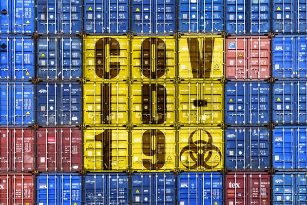 PHOTOMONTAGE, Stacked containers with Covid 19 lettering, topic coronavirus and economic crisis ** NUR FUER REDAKTIONELLE ZWECKE ** EDITORIAL USE ONLY **