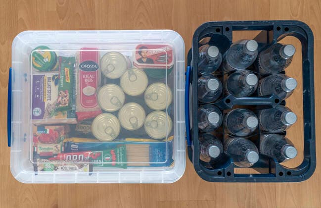 Emergency precautions, food stock in a private household, box with long-life food, stock for 10 days, according to the recommendations of the Federal Office for Civil Protection and Disaster Assistance, emergency precautions