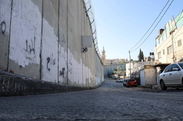 March 8, 2020, Jerusalem, West Bank, Palestinian Territory: A picture shows a side of the Israeli separation wall arround Jerusalem in Jerusalem s Old city,on March 8, 2020. In June 2002, the Israeli cabinet decided to construct the separation wall. The decision was made following a long string of attacks perpetrated by Palestinians against Israelis. The declared objective was preventing Palestinians without permits from entering Israel from the West Bank. However, the establishment of the barrier was also intended to serve other, undeclared aims. A key factor in determining the barrier™s route was the location of settlements, thereby laying the groundwork for the de facto annexation of most of the settlements and much land for their future expansion Jerusalem Palestinian Territory - ZUMAap3_ 20200308_zaf_ap3_218 Copyright: xMuhammedxQaroutxIdkaidekx