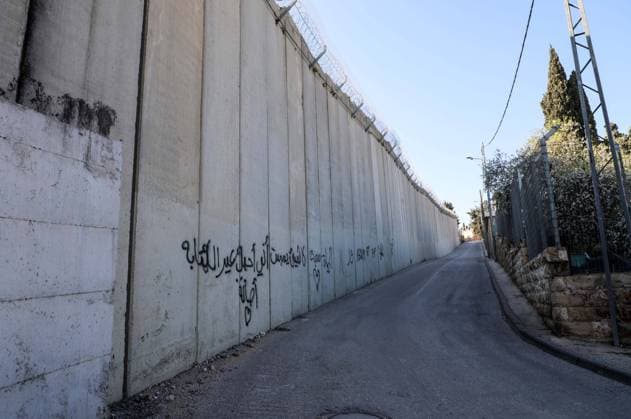March 8, 2020, Jerusalem, West Bank, Palestinian Territory: A picture shows a side of the Israeli separation wall arround Jerusalem in Jerusalem s Old city,on March 8, 2020. In June 2002, the Israeli cabinet decided to construct the separation wall. The decision was made following a long string of attacks perpetrated by Palestinians against Israelis. The declared objective was preventing Palestinians without permits from entering Israel from the West Bank. However, the establishment of the barrier was also intended to serve other, undeclared aims. A key factor in determining the barrier™s route was the location of settlements, thereby laying the groundwork for the de facto annexation of most of the settlements and much land for their future expansion Jerusalem Palestinian Territory - ZUMAap3_ 20200308_zaf_ap3_241 Copyright: xMuhammedxQaroutxIdkaidekx
