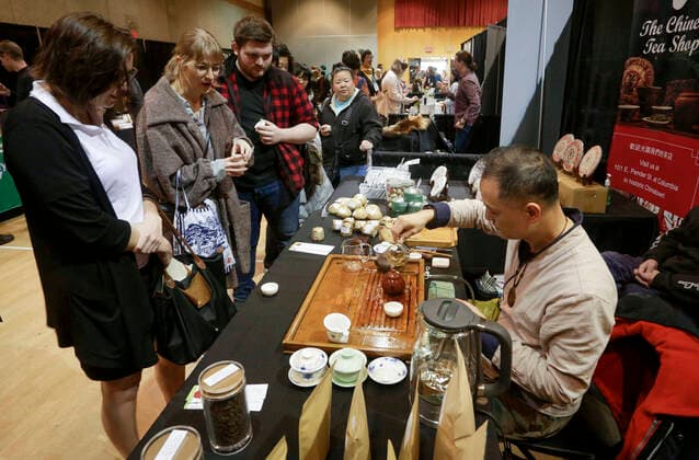 (200308) -- VANCOUVER, March 8, 2020 (Xinhua) -- People watch demonstration of Chinese tea making during the sixth annual Vancouver Tea Festival in Vancouver, Canada, March 8, 2020. The Vancouver Tea Festival returned for the sixth year this weekend, featuring tea manufacturers, connoisseurs and vendors exhibiting different types of tea from around the world. (Photo by Liang Sen Xinhua) CANADA-VANCOUVER-TEA FESTIVAL 