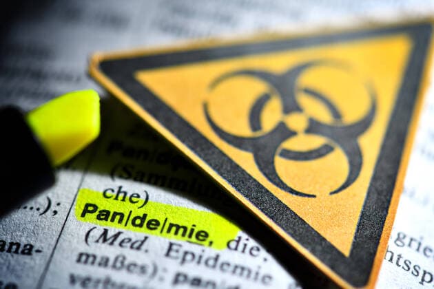 The word pandemic in the dictionary and biohazard signs, symbol photo Corona crisis ** NUR FUER REDAKTIONELLE ZWECKE ** EDITORIAL USE ONLY **