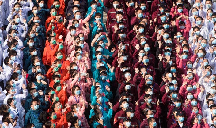 (200310) -- WUHAN, March 10, 2020 -- Medical workers wave to celebrate after the closure of a temporary hospital in Wuchang District of Wuhan, central China s Hubei Province, March 10, 2020. The last two temporary hospitals in Wuhan, the epicenter of the coronavirus outbreak in central China s Hubei Province, were shut down Tuesday, marking the closure of all 16 temporary hospitals in the city. ) CHINA-WUHAN-TEMPORARY HOSPITALS-CLOSURE (CN) XiaoxYijiu 