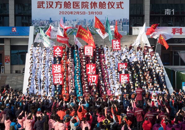 (200310) -- WUHAN, March 10, 2020 -- Medical workers celebrate after the closure of a temporary hospital in Wuchang District of Wuhan, central China s Hubei Province, March 10, 2020. The last two temporary hospitals in Wuhan, the epicenter of the coronavirus outbreak in central China s Hubei Province, were shut down Tuesday, marking the closure of all 16 temporary hospitals in the city. ) CHINA-WUHAN-TEMPORARY HOSPITALS-CLOSURE (CN) XiaoxYijiu 