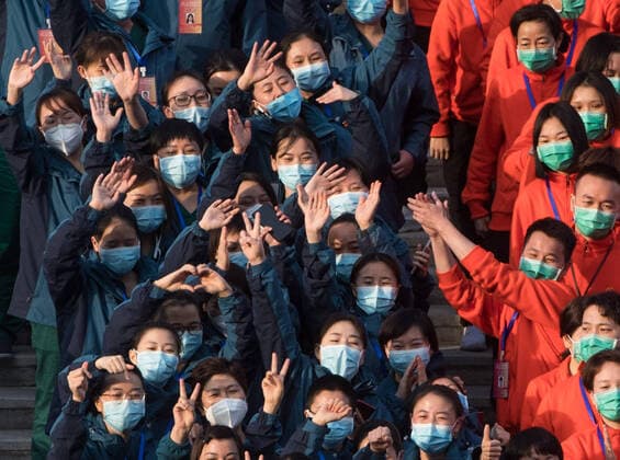 (200310) -- WUHAN, March 10, 2020 -- Medical workers celebrate after the closure of a temporary hospital in Wuchang District of Wuhan, central China s Hubei Province, March 10, 2020. The last two temporary hospitals in Wuhan, the epicenter of the coronavirus outbreak in central China s Hubei Province, were shut down Tuesday, marking the closure of all 16 temporary hospitals in the city. ) CHINA-WUHAN-TEMPORARY HOSPITALS-CLOSURE (CN) XiaoxYijiu 