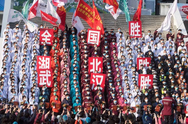 (200310) -- WUHAN, March 10, 2020 -- Medical workers celebrate after the closure of a temporary hospital in Wuchang District of Wuhan, central China s Hubei Province, March 10, 2020. The last two temporary hospitals in Wuhan, the epicenter of the coronavirus outbreak in central China s Hubei Province, were shut down Tuesday, marking the closure of all 16 temporary hospitals in the city. ) CHINA-WUHAN-TEMPORARY HOSPITALS-CLOSURE (CN) XiaoxYijiu 