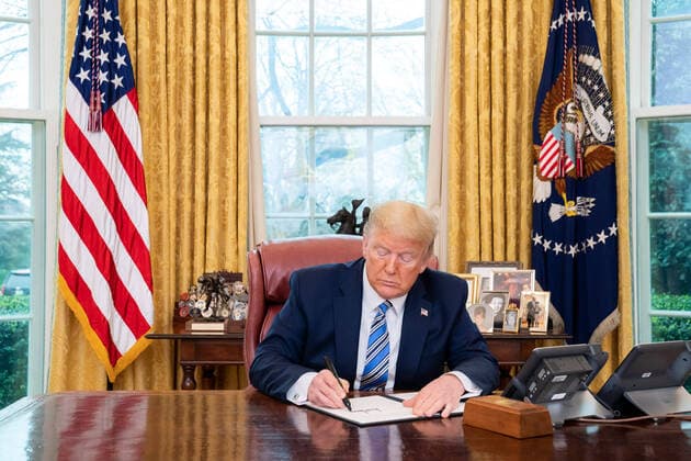 March 11, 2020, Washington, District of Columbia, USA: President DONALD TRUMP signs a Presidential Memorandum in the Oval Office of the White House, Wednesday, or the Secretary of Health and Human Services and the Secretary of Labor on making general use face masks available to our healthcare workers. Washington U.S. - ZUMAz03_ 20200311_sha_z03_541 Copyright: xTiaxDufour WhitexHousex