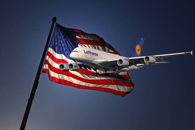 Fear of the coronavirus, the U.S. imposes an entry ban for 30 days of travel from Europe to the U.S., that entry ban will apply from Friday 13 03 2020 23 59 local time Photomontage, symbolic image, a U.S. flag, in front of it an aircraft of the airline Lufthansa, Airbus A380 800 Germany Identification D AIMN on approach symbolic image, entry ban to the U.S. 12 03 2020 in Siegen Germany