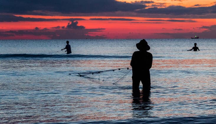 A fisherman is fishing at Sunset on Koh Rong, Cambodia Krong Siem Reap, Siem Reap Province, Cambodia CR_DKOC200121D-288898-01