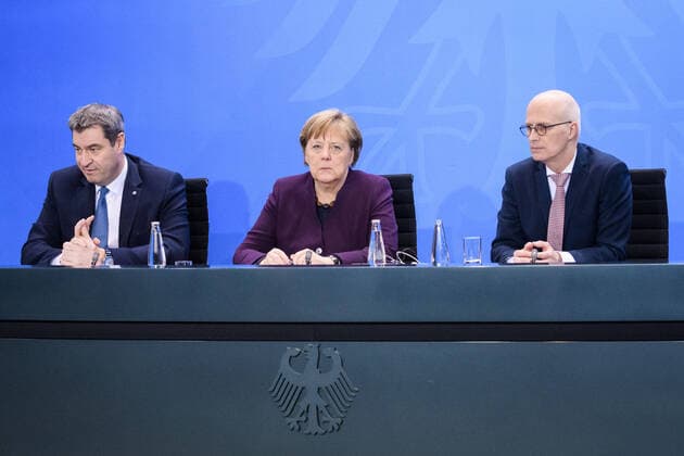 Berlin, Press Conference Merkel, Söder and Cschentscher Germany, Berlin 12 03 2020 The picture shows Markus Söder Bavarian Prime Minister, csu , Angela Merkel Federal Chancellor, cdu and Peter Cschentscher First Mayor of Hamburg, spd during the press briefing after the Chancellors meeting with the heads of government of the federal states Berlin Federal Chancellery Berlin Germany