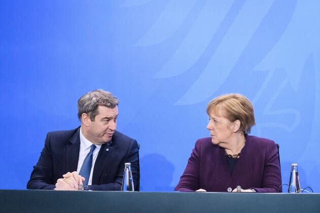 Berlin, Press Conference Merkel, Söder and Czestscher Germany, Berlin 12 03 2020 In the picture are Markus Söder Bavarian Prime Minister, csu and Angela Merkel Federal Chancellor, cdu during the press briefing after the Chancellors talk with the heads of government of the federal states Berlin Federal Chancellery Berlin Germany