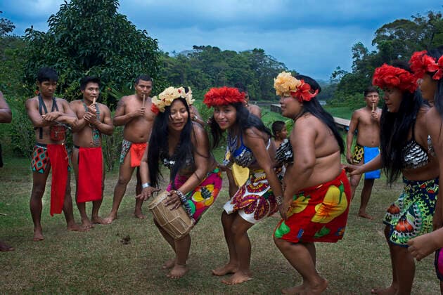 Music and dancing in the village of the Native Indian Embera Tribe, Embera Village, Panama. Panama Embera people Indian Village Indigenous Indio indios natives Native americans locals local Parque National Chagres. Embera Drua. Embera Drua is located on the Upper Chagres River. A dam built on the river in 1924 produced Lake Alajuela, the main water supply to the Panama Canal. The village is four miles upriver from the lake, and encircled by a 129.000 hectare National Park of primary tropical rainforest. Lake Alajuela can be accessed by bus and mini-van from the city of Panama. It lies an hour from the city, close to the town of Las Cumbres. From a spot called Puerto El Corotu (less a port than a muddy bank with a little store that serves as a dock to embark and disembark from canoes) on the shore of the lake, it takes 45 minutes to an hou Copyright: xSergixReboredox SRE-086-CX2280